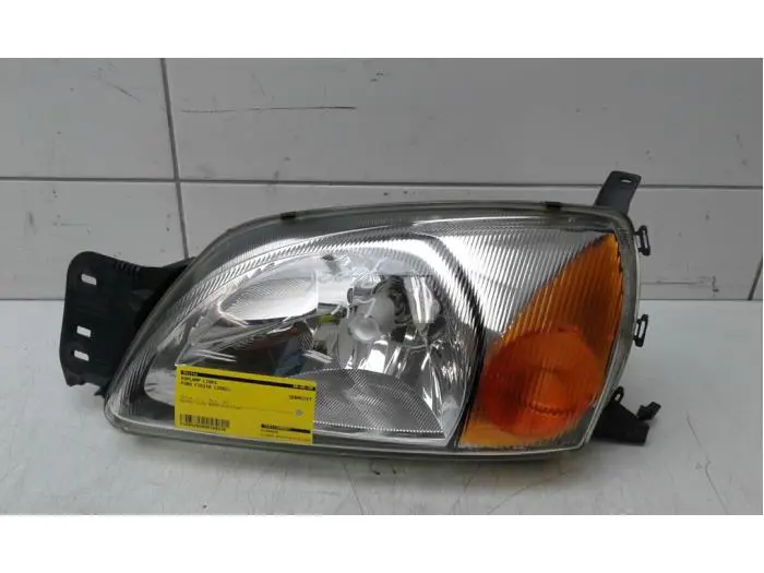 Headlight, left Ford Fiesta