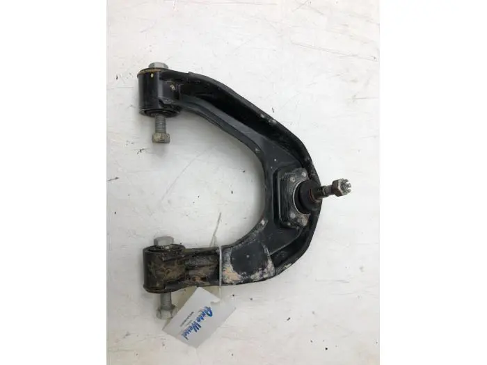 Front wishbone, left Nissan NT400