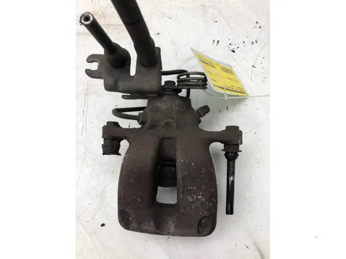 Rear brake calliper, left Volkswagen Caddy