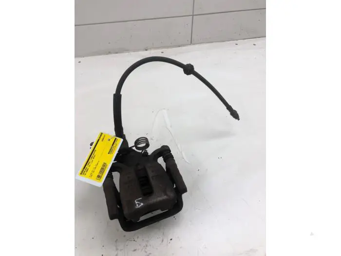 Rear brake calliper, left Volkswagen Caddy