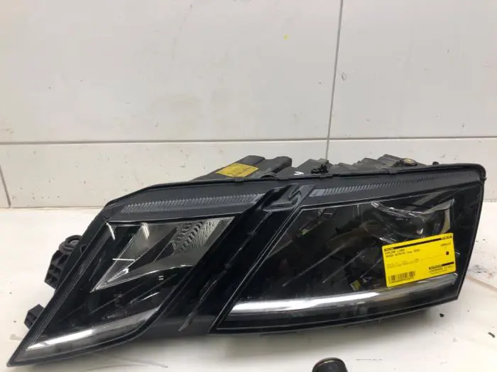 Headlight, left Skoda Octavia